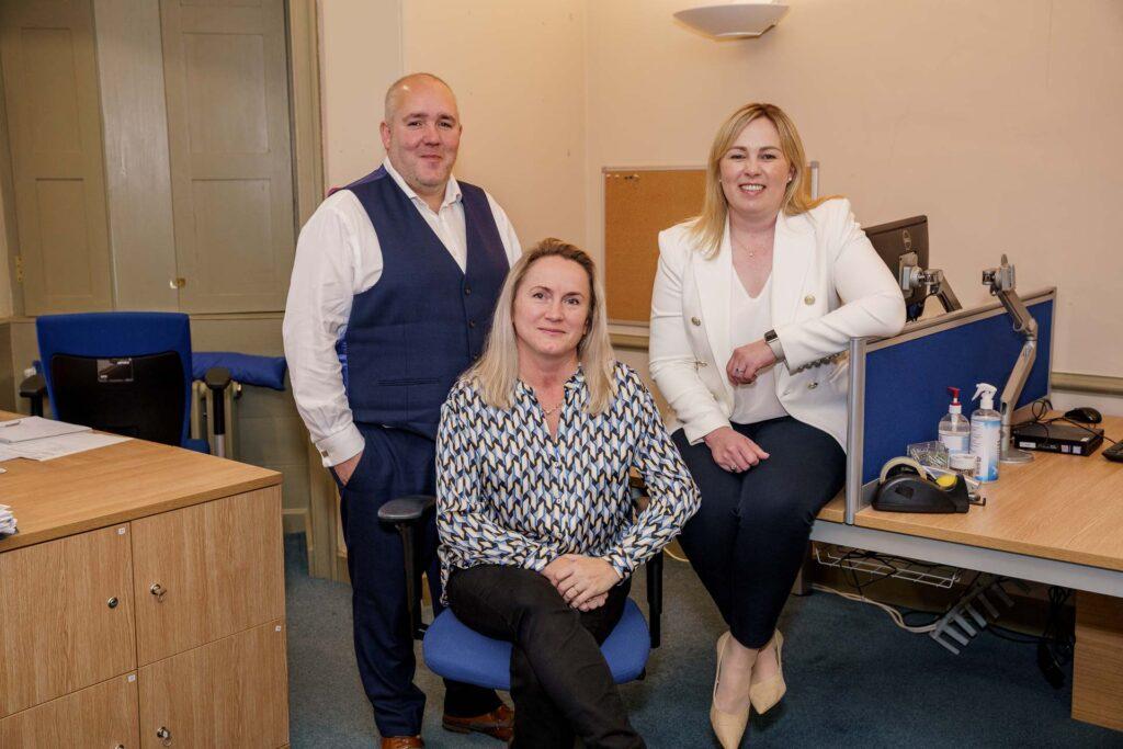 A photograph of the Fitwise Finance Team in the finance office